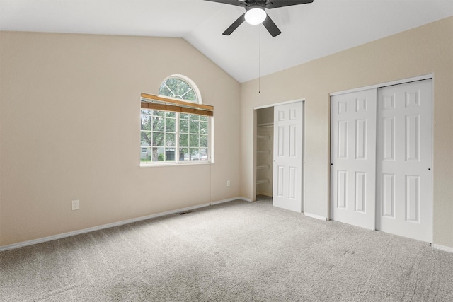 4012 Lancaster Rd, Missoula, MT 59808 - unfurnished bedroom with two closets, carpet, vaulted ceiling, and ceiling fan