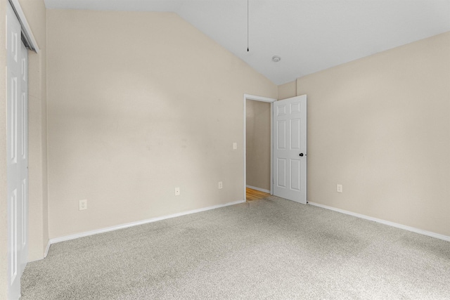 4012 Lancaster Rd, Missoula, MT 59808 - unfurnished bedroom with vaulted ceiling, light carpet, and a closet