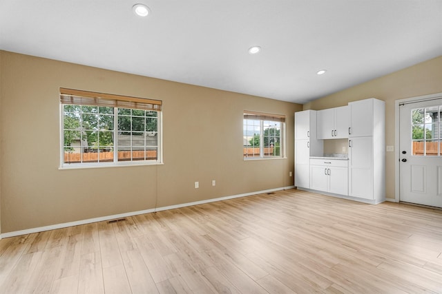 4012 Lancaster Rd, Missoula, MT 59808 - unfurnished living room featuring healthy amount of natural light, light wood-style floors, and recessed lighting