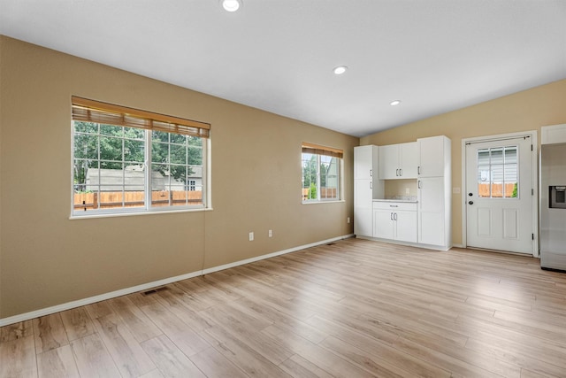 4012 Lancaster Rd, Missoula, MT 59808 - unfurnished living room with light wood-style floors, recessed lighting, and lofted ceiling