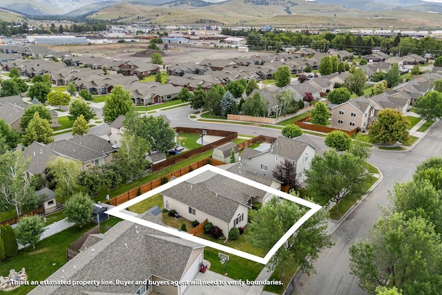 4012 Lancaster Rd, Missoula, MT 59808 - aerial perspective of suburban area with property boundaries highlighted and a mountainous background