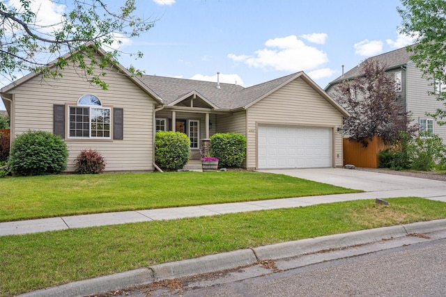 4012 Lancaster Rd, Missoula, MT 59808 - ranch-style house featuring an attached garage, driveway, a front lawn, and a shingled roof