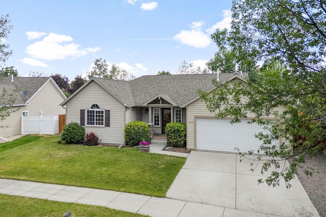 4012 Lancaster Rd, Missoula, MT 59808 - view of front of house with a garage, concrete driveway, and a shingled roof