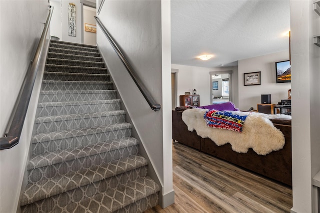 6910 Shaver Dr, Missoula, MT 59803 - stairs with wood finished floors and a textured ceiling