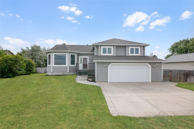 3477 Birkland Dr, Helena, MT 59602 - split level home with an attached garage, concrete driveway, and a shingled roof