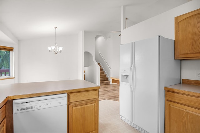 3477 Birkland Dr, Helena, MT 59602 - kitchen featuring white appliances, light countertops, decorative light fixtures, a chandelier, and light flooring