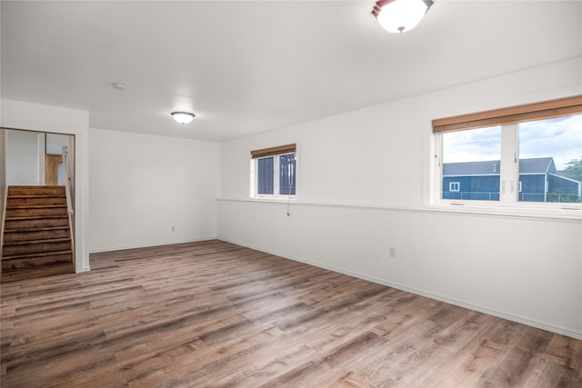 3477 Birkland Dr, Helena, MT 59602 - spare room featuring wood finished floors, healthy amount of natural light, and stairs