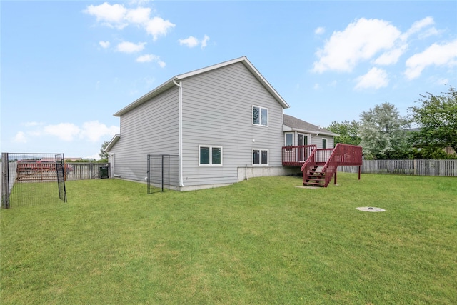 3477 Birkland Dr, Helena, MT 59602 - rear view of property featuring a wooden deck, a fenced backyard, and stairs