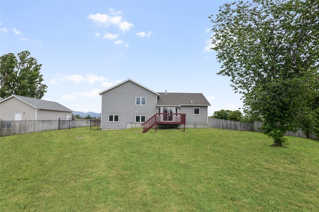 3477 Birkland Dr, Helena, MT 59602 - back of house with a fenced backyard, a deck, and stairway