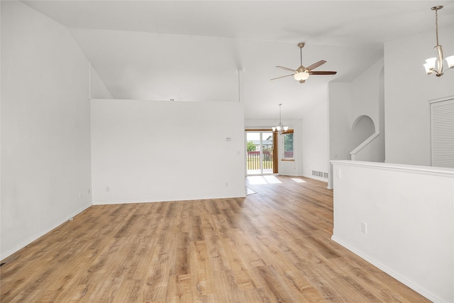 3477 Birkland Dr, Helena, MT 59602 - unfurnished room with a chandelier, a ceiling fan, light wood-type flooring, and high vaulted ceiling
