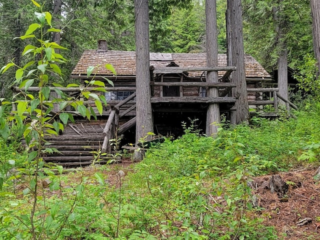 489 Grist Rd, West Glacier, MT 59936 - back of property featuring a chimney