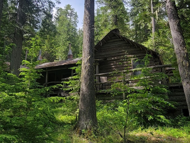 489 Grist Rd, West Glacier, MT 59936 - back of property with a forest view