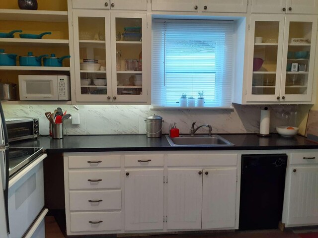 905 3rd Ave E, Kalispell, MT 59901 - kitchen featuring white microwave, dark countertops, range with electric cooktop, and white cabinetry