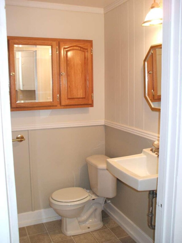 905 3rd Ave E, Kalispell, MT 59901 - half bath with ornamental molding and tile patterned flooring