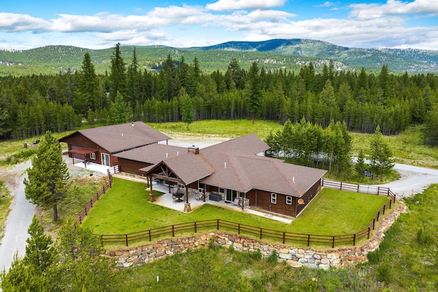 71 Cw Mitchell Ct, Marion, MT 59925 - view from above of property with a heavily wooded area and mountains