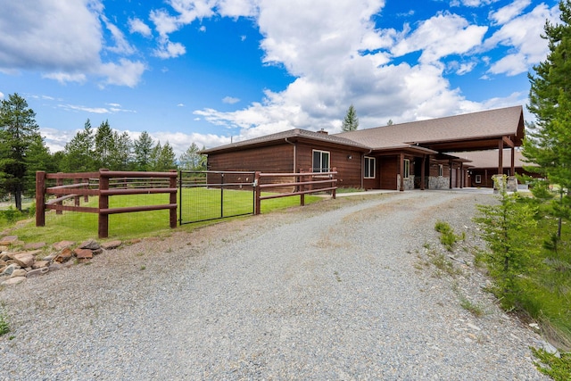 71 Cw Mitchell Ct, Marion, MT 59925 - rustic home with an exterior structure and driveway