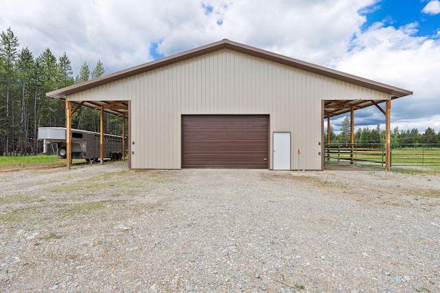 71 Cw Mitchell Ct, Marion, MT 59925 - garage featuring a garage and gravel driveway