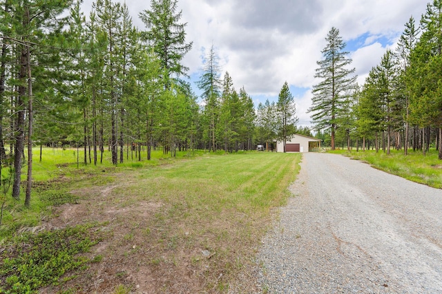 71 Cw Mitchell Ct, Marion, MT 59925 - view of front of home with driveway and a wooded view