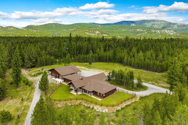 71 Cw Mitchell Ct, Marion, MT 59925 - view from above of property featuring a forest and a mountain backdrop