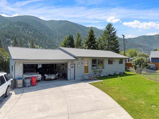 13 Canyon View Dr, Missoula, MT 59802 - ranch-style house with a mountain view, a garage, concrete driveway, and roof with shingles