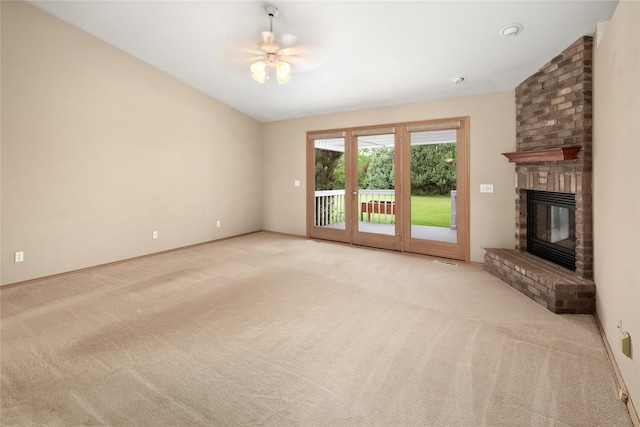 133 Trailridge Rd, Kalispell, MT 59901 - unfurnished living room featuring light colored carpet, a brick fireplace, and ceiling fan