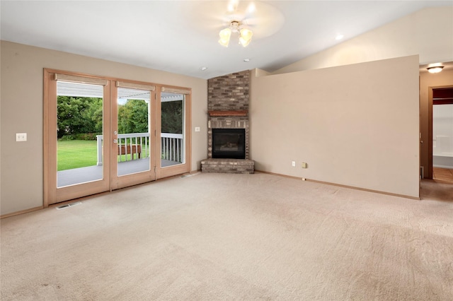 133 Trailridge Rd, Kalispell, MT 59901 - unfurnished living room featuring lofted ceiling, carpet, and a brick fireplace