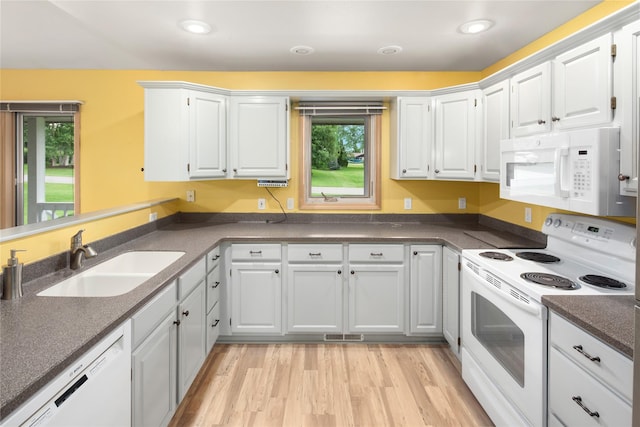 133 Trailridge Rd, Kalispell, MT 59901 - kitchen with white appliances, plenty of natural light, white cabinets, and recessed lighting