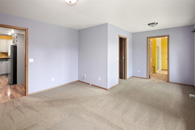133 Trailridge Rd, Kalispell, MT 59901 - spare room featuring light colored carpet and baseboards