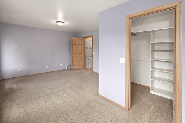 133 Trailridge Rd, Kalispell, MT 59901 - unfurnished bedroom with carpet flooring, a spacious closet, and a closet