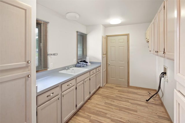 133 Trailridge Rd, Kalispell, MT 59901 - washroom with cabinet space and light wood-style flooring
