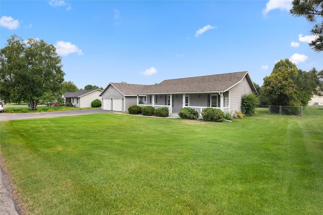 133 Trailridge Rd, Kalispell, MT 59901 - ranch-style home with covered porch, asphalt driveway, and an attached garage