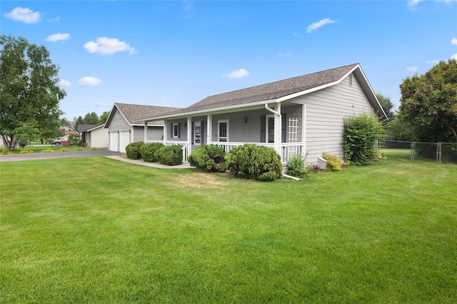 133 Trailridge Rd, Kalispell, MT 59901 - view of front facade with covered porch, an attached garage, asphalt driveway, and roof with shingles