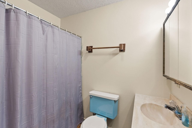 1255 Tamarack Ln, Columbia Falls, MT 59912 - full bath with a textured ceiling, vanity, and curtained shower
