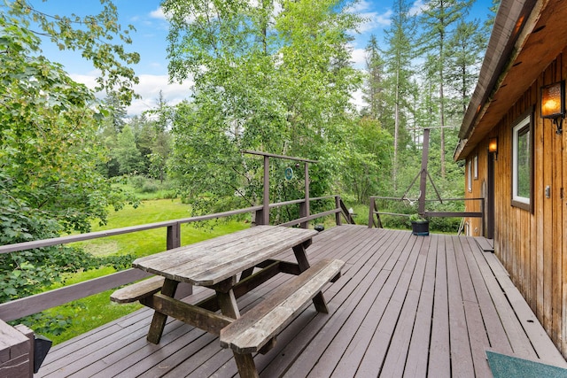 1255 Tamarack Ln, Columbia Falls, MT 59912 - wooden deck with outdoor dining area