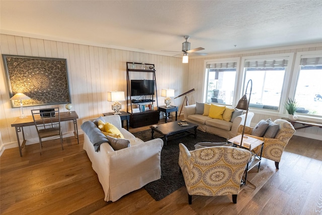 7175 US Highway 93 S, Lakeside, MT 59922 - living room featuring wood finished floors, ceiling fan, and wooden walls