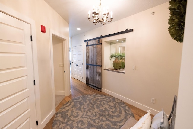 7175 US Highway 93 S, Lakeside, MT 59922 - entryway with a chandelier, wood finished floors, a barn door, and recessed lighting