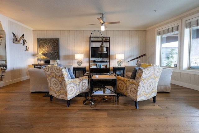 7175 US Highway 93 S, Lakeside, MT 59922 - living room featuring ornamental molding, wood finished floors, ceiling fan, and wood walls