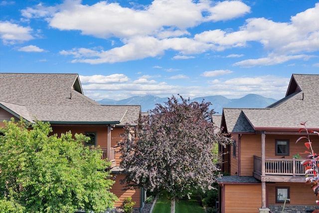 6201 Shiloh Ave Unit G, Whitefish, MT 59937 - exterior space with a balcony, a mountain view, and a shingled roof