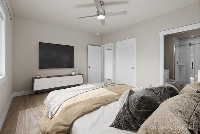 6201 Shiloh Ave Unit G, Whitefish, MT 59937 - bedroom featuring wood finished floors, connected bathroom, and ceiling fan