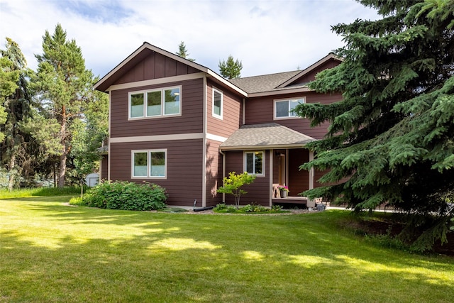 634 Country Way, Kalispell, MT 59901 - view of front of house with a front lawn, board and batten siding, and a shingled roof