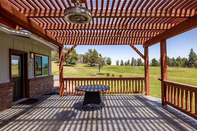 2206 US Highway 2 W, Kalispell, MT 59901 - wooden terrace featuring a pergola, a yard, and a ceiling fan
