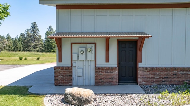2206 US Highway 2 W, Kalispell, MT 59901 - view of exterior entry featuring brick siding and board and batten siding