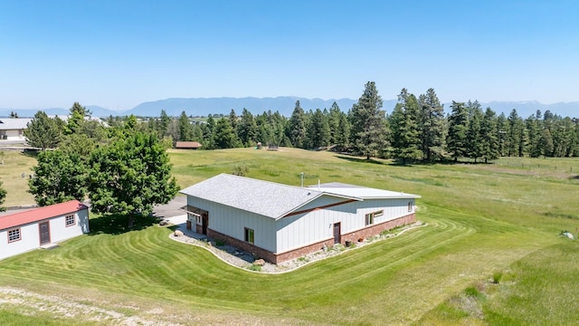 2206 US Highway 2 W, Kalispell, MT 59901 - aerial view of property and surrounding area featuring a mountainous background