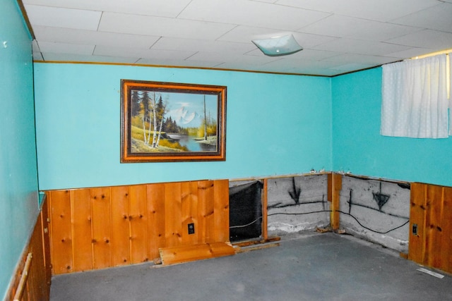 1108 5th St E, Polson, MT 59860 - below grade area featuring wooden walls and a wainscoted wall