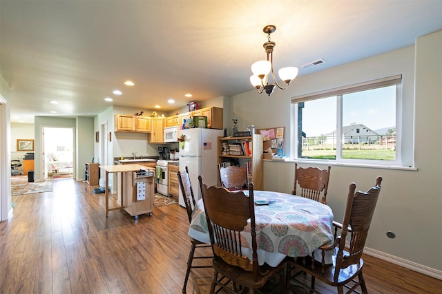4927 Hoblitt Ln S, Florence, MT 59833 - dining area featuring a chandelier, wood finished floors, and recessed lighting