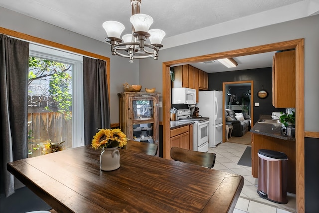 2321 8th Ave S, Great Falls, MT 59405 - dining room featuring a chandelier and light tile patterned floors