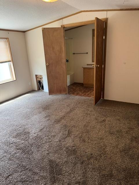 1830 Beech St, Helena, MT 59601 - unfurnished bedroom featuring carpet flooring, lofted ceiling, and ensuite bathroom