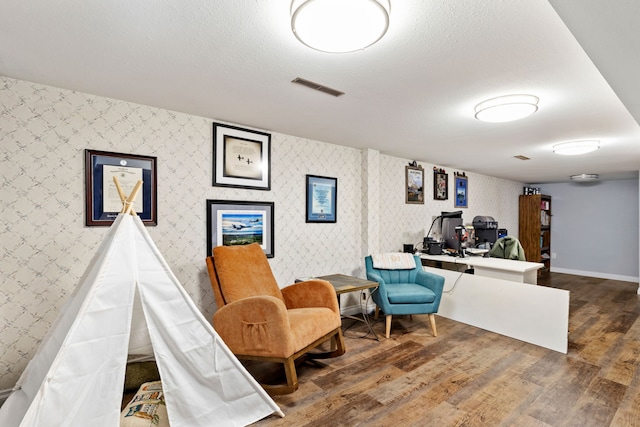2604 5th Ave S, Great Falls, MT 59405 - living area featuring wood finished floors, wallpapered walls, and an office area