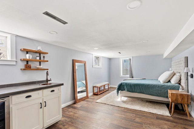 2604 5th Ave S, Great Falls, MT 59405 - bedroom with wine cooler, wood finished floors, and recessed lighting