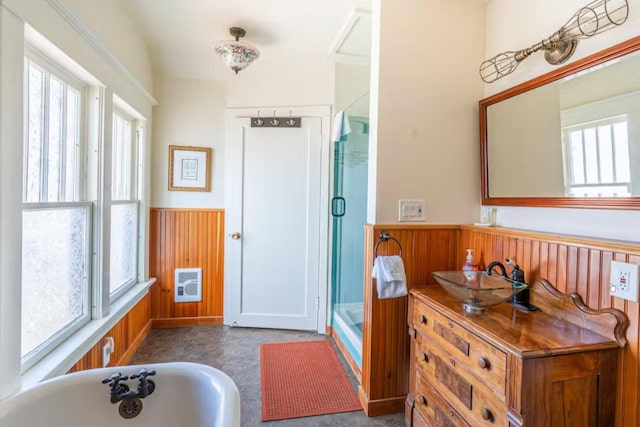 1046 3rd Ave E, Kalispell, MT 59901 - full bath with healthy amount of natural light, a bath, wainscoting, an enclosed shower, and vanity
